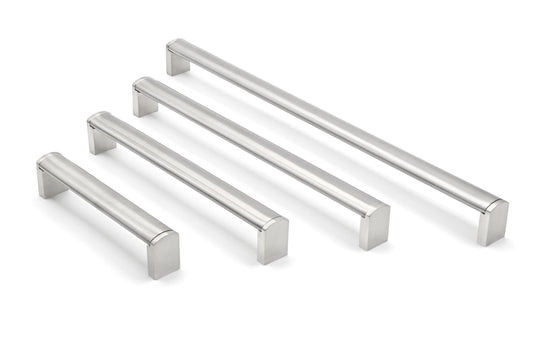 Set of metallic cabinet handles on a white background