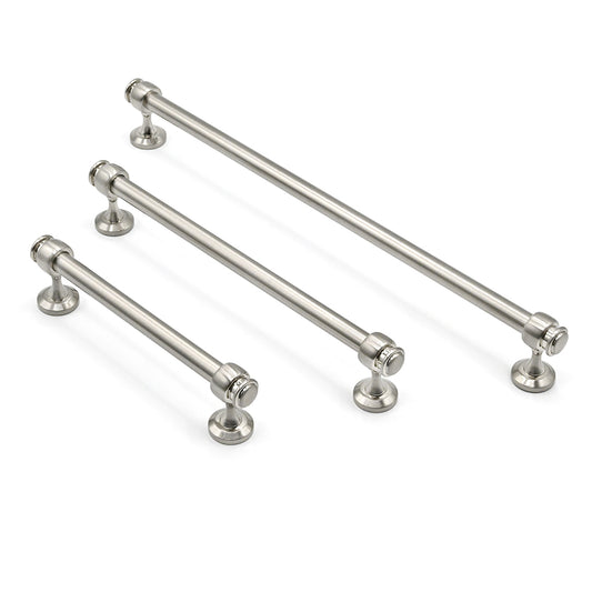 Set of metallic cabinet handles on a white background