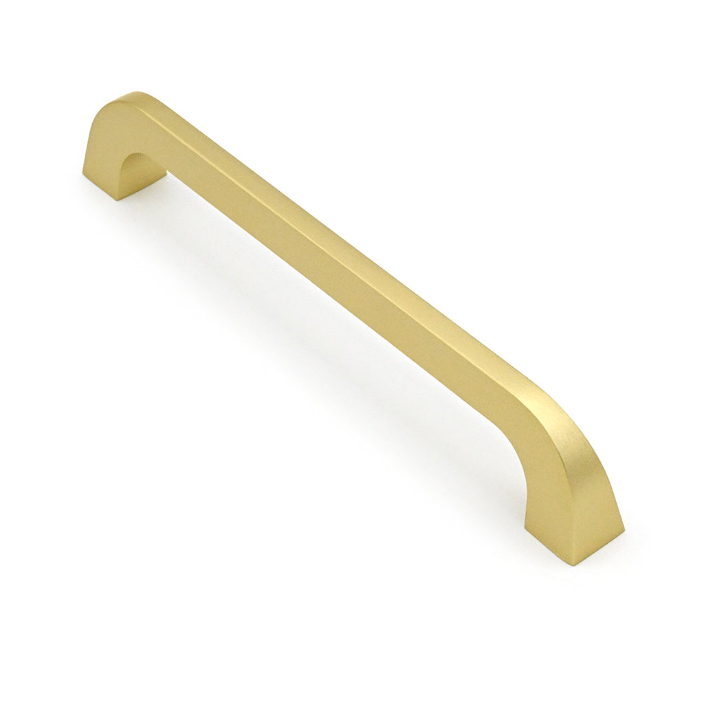 Gold cabinet handle on a white background