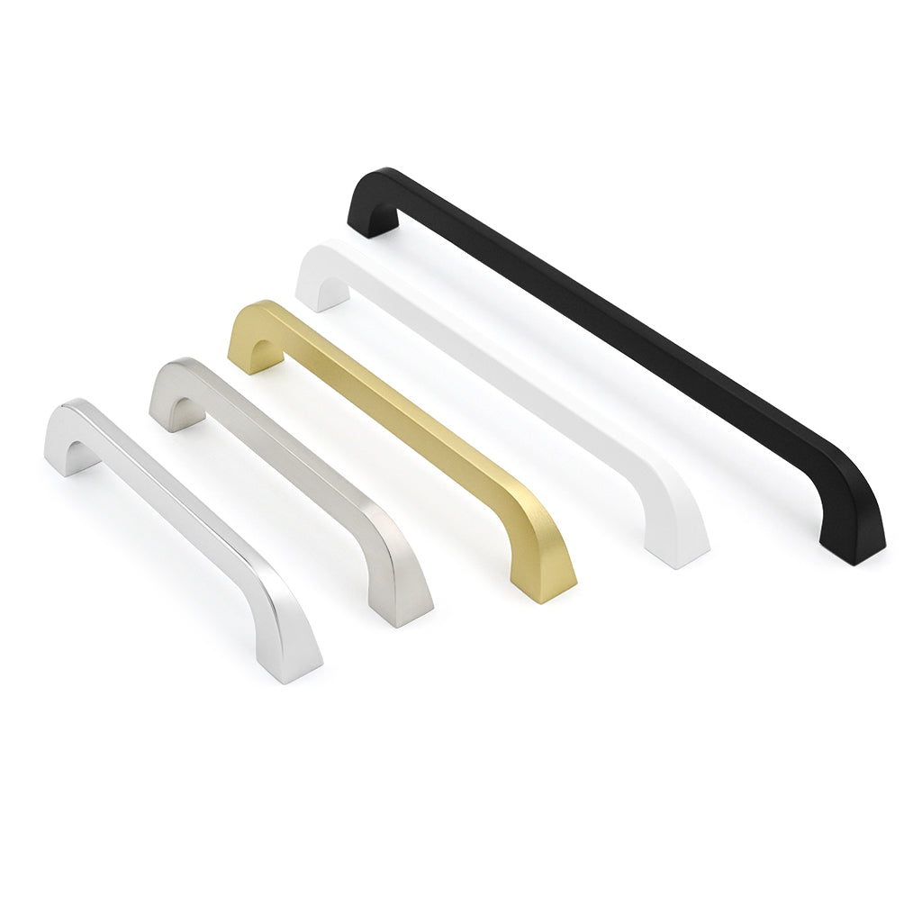 Set of four metallic cabinet handles in black, gold, and silver on a white background