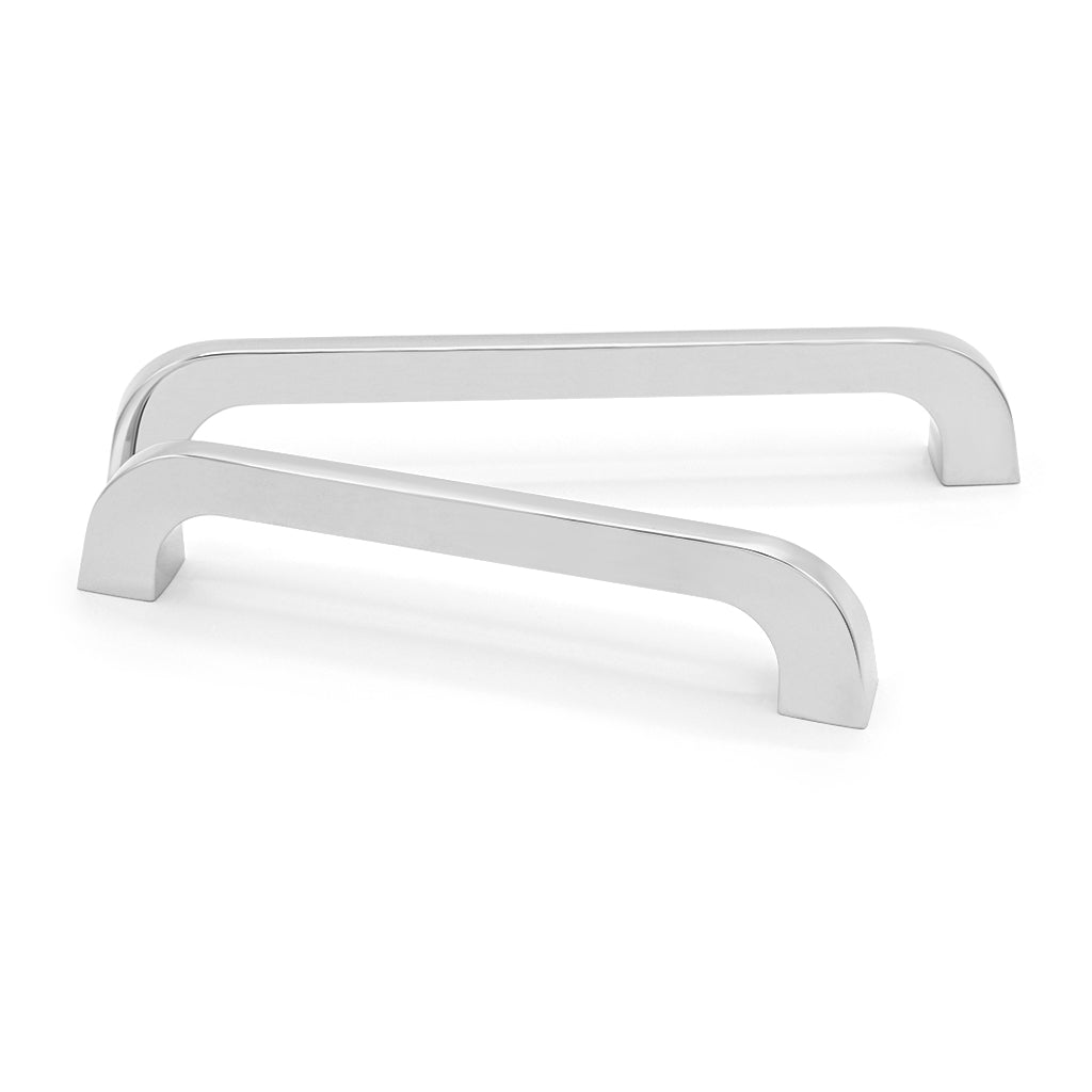 Two white cabinet handles