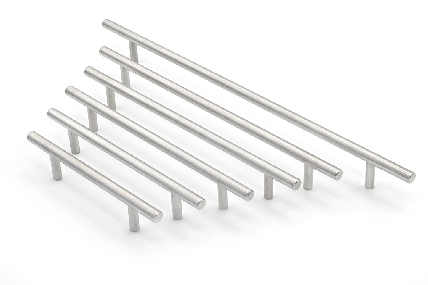 Set of metallic cabinet handles on a white background