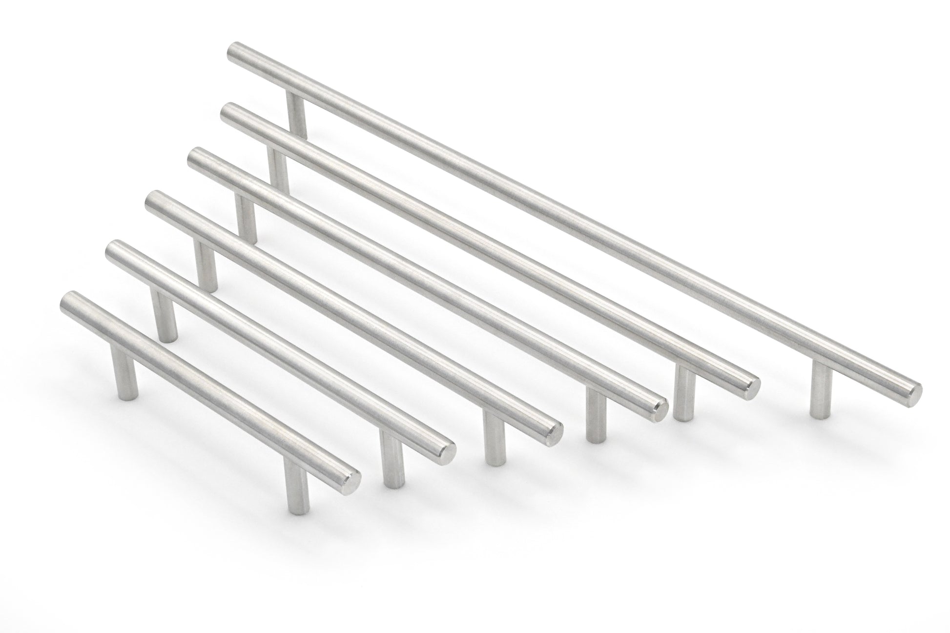 Set of metallic cabinet handles on a white background