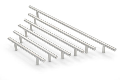 Set of metallic cabinet handles on a white background