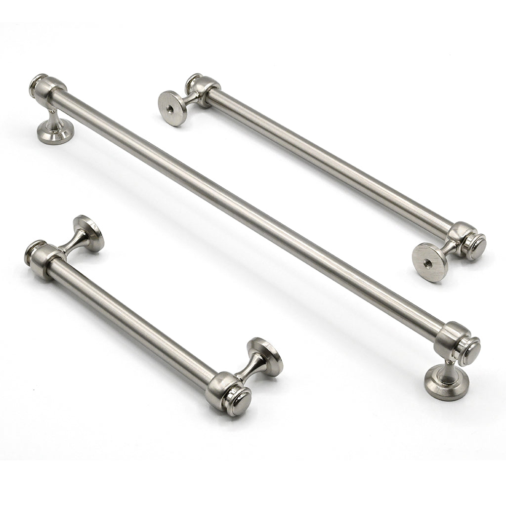 Set of metallic cabinet handles on a white background